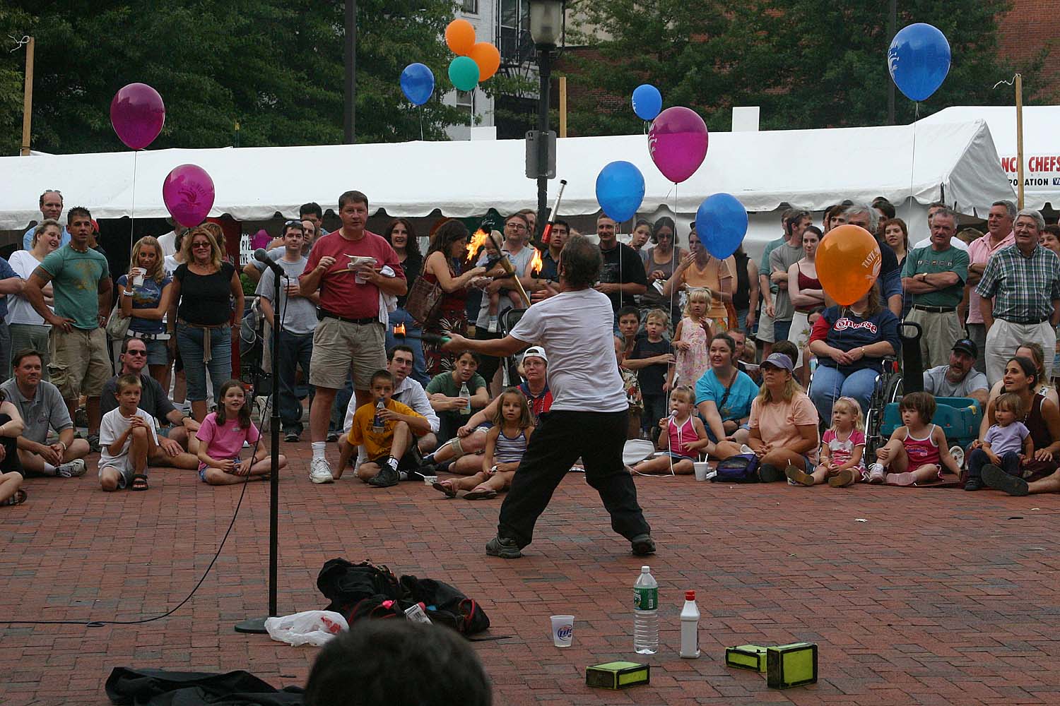 19 juggling three burning torches