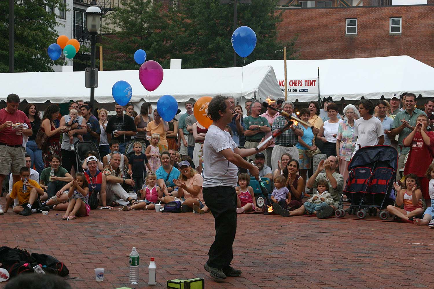 20 juggling three burning torches