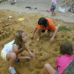 47_all_three_girls_building_the_sand_castle
