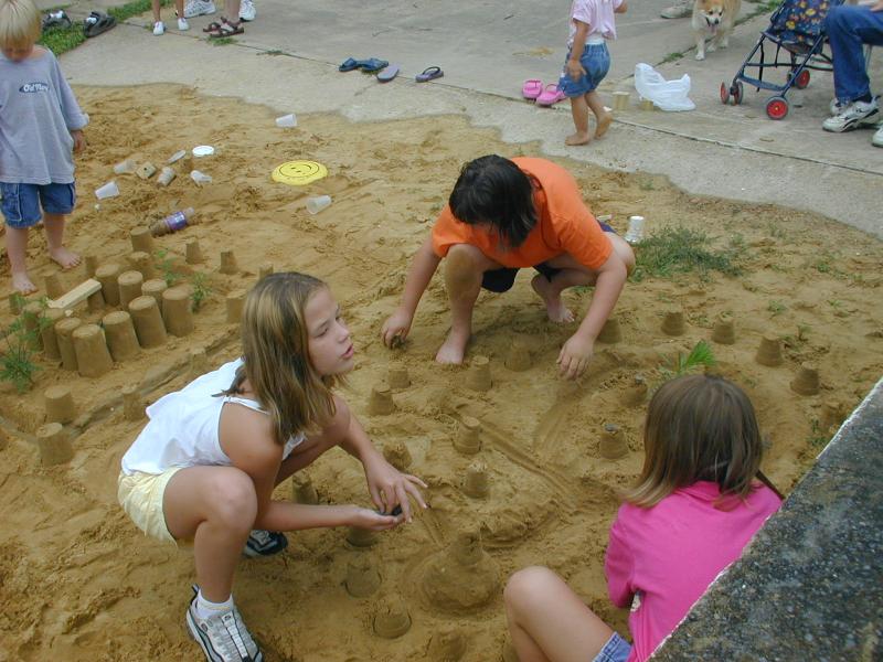 47_all_three_girls_building_the_sand_castle