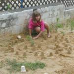 48_Rebecca_working_on_the_sand_castle