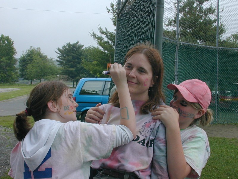 01 Kim writes on Coach Mary while Jordan holds her